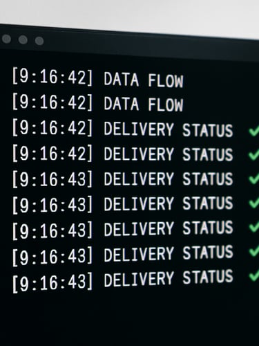 A crisp terminal interface showing clean data flows and successful delivery status logs, high-key bright studio light, sharp defined shadows.