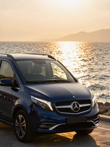 An immaculate luxury Mercedes Vito parked near the Antalya coast at golden hour, sparkling clean chassis, warm Mediterranean sunlight reflecting off the sea in the background
