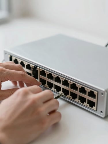 Close-up of hands working on high-end network switch, soft daylight, silver and slate tones, shallow depth of field