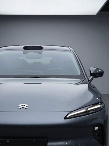 Sleek, isolated silhouette of a premium electric sedan in a dark studio, sharp metallic reflections on the hood, high-contrast overcast lighting.