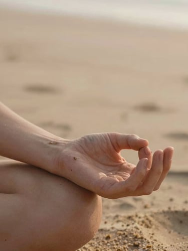 Close-up of hands in a quiet mudra, resting on warm sand-colored fabric, soft morning daylight, shallow depth of field, 35mm editorial photography.