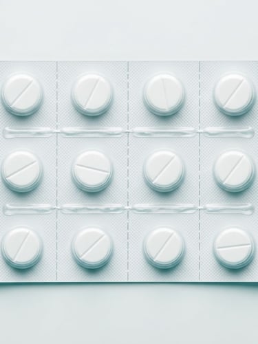Macro clinical shot of professional blister packaging on a sterile white surface, bright high-key white light, subtle teal shadows, sharp focus, 50mm lens, professional pharmaceutical B2B presentation.