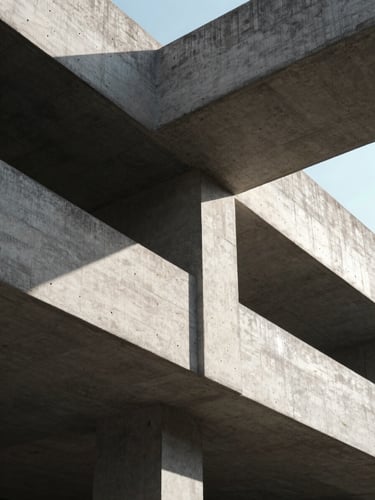 Low-angle architectural photography of a raw concrete cantilever structure, high-contrast afternoon sun casting sharp geometric shadows, sharp structural details, 35mm lens