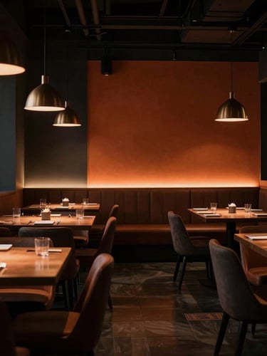 Cinematic interior of a modern regional restaurant, elegant lighting, deep shadows, rich ochre accents, uncrowded composition