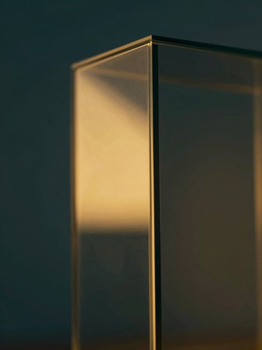 Macro close-up of a premium digital interface reflecting golden studio light on dark glass, architectural geometric focus, 35mm