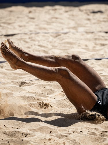 Tight action crop of a footvolley player performing a dramatic chest attack, sand flying, high-contrast midday sun, deep shadows, editorial sports photography, 85mm