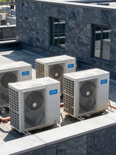 Sleek modern building rooftop with neatly aligned VRF condenser units, copper piping runs, bright natural daylight, crisp architectural photography, slate-gray tones