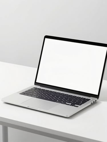 Sleek modern laptop computer open on a minimalist white desk, bright high-key product photography, crisp details, clean studio lighting with soft shadows