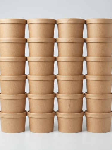 Straight-on studio shot of neatly stacked kraft paper food containers, bright high-key even lighting, seamless light gray background