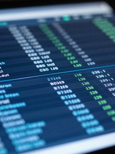 Tight macro shot of a crisp data dashboard on a physical screen, cool high-contrast blue light, analytical tools visible in the shallow depth of field.