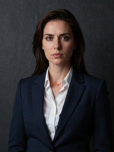 Dramatic portrait of a female geopolitical risk researcher, cool tones, dark slate background, sharp lighting