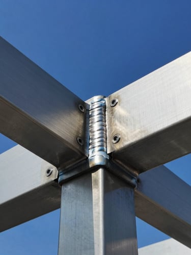 Macro shot of a seamless weld on a stainless steel structural sign frame, crisp daylight reflecting off brushed metal, technical precision, high-contrast.