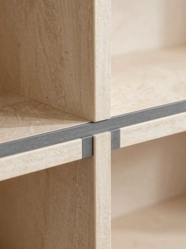 Macro shot of a craftsman leveling a bespoke cabinet joint, warm stone and charcoal tones, sharp focus, 35mm