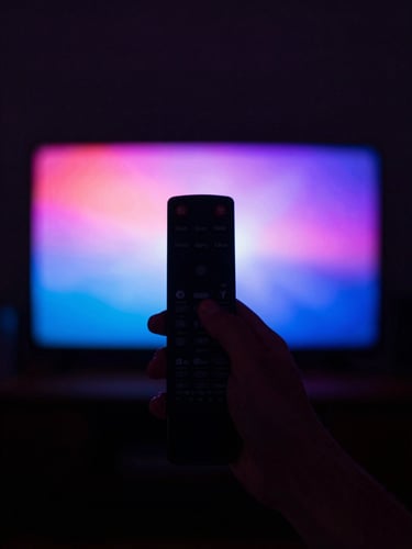 A hand holding a remote control, silhouetted against a vibrant neon-lit TV screen projecting deep dark tones, atmospheric cinematic lighting, shallow depth of field