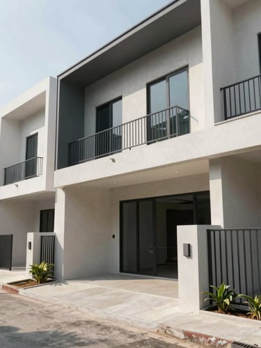 Wide-angle exterior shot of a modern completed townhouse in Ho Chi Minh City, natural daylight, sharp architectural lines and clean concrete shadows