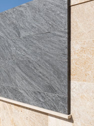 Architectural portrait of a premium high-performance thermal insulation material texture, bright natural Mediterranean daylight, clean structural lines, 35mm