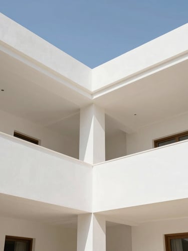 Wide-angle architectural photograph of a luxury villa interior at Damac Lagoons, showcasing crisp gypsum ceiling joints and smooth white painted walls under bright natural daylight, 35mm