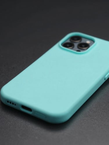 Sleek close-up of a minimalist biodegradable phone case on a dark metallic surface, soft cyan ambient back-glow, crisp studio lighting, macro lens