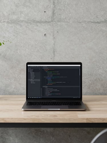 Minimalist clean workspace setup with natural side-light, a high-end laptop displaying clean code architecture, set against a concrete wall with soft vineyard green accents, 35mm lens editorial photography