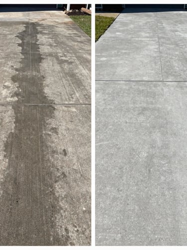 Split-screen before and after of a concrete driveway. Left side is dark, oil-stained, and covered in black grime. Right side is bright, clean, restored concrete, sharp focus, direct midday sunlight.