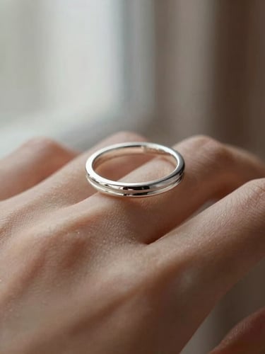 Macro photography of a delicate silver ring on a woman's hand, soft natural window light, elegant brown linen background, shallow depth of field, 35mm