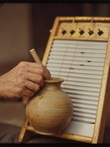 Close-up of hands playing a custom-tuned clay jug and a vintage washboard with rich brass hardware, warm golden-hour light, sepia-tinted tintype style, high-grain 35mm film texture.