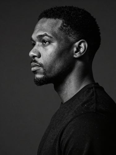 Sharp black and white studio portrait of Marcus Vance, dramatic side lighting, deep charcoal background, high-contrast editorial style.