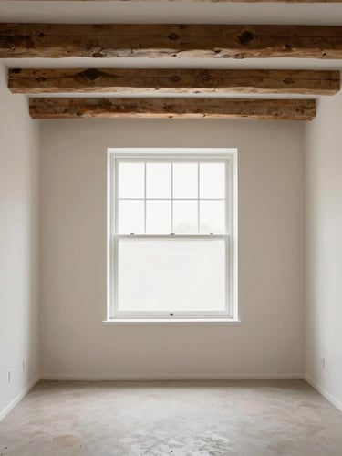 Straight-on architectural photography of a restored living room with exposed timber beams, bright natural window light, clean neutral tones, sharp focus