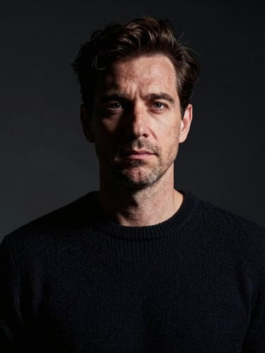 Chiaroscuro studio portrait of a man in a dark knit sweater, dramatic Rembrandt lighting casting deep shadows on one side of his face, high-contrast, dark background