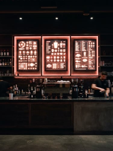 Straight-on architectural shot of a sleek digital menu board glowing behind a modern dark cafe counter, soft red LED ambient light, 35mm