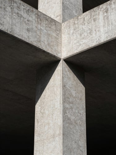 Stark close-up of heavy brutalist concrete architectural joints, sharp linear shadows, cold north-facing daylight, high-contrast, minimalist composition.