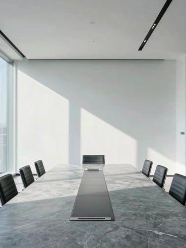 Bright architectural interior of a modern corporate boardroom with a polished large table, clean minimalist glass walls, natural daylight casting sharp lines, cool slate tones, 35mm lens.