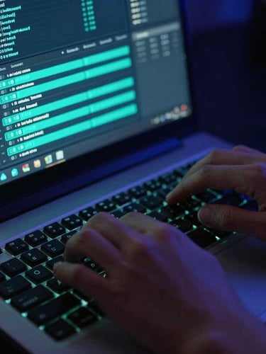 Tight macro shot of hands typing on a mechanical keyboard in front of a laptop displaying a node-based automation workflow, vibrant teal backglow, shallow depth of field.