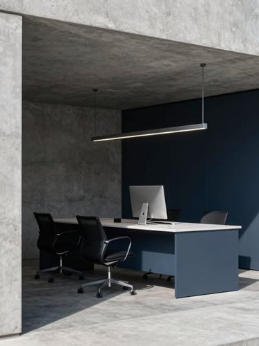 Crisp natural side-lighting on a modern architectural concrete workspace with deep slate shadows, 35mm editorial corporate photography.