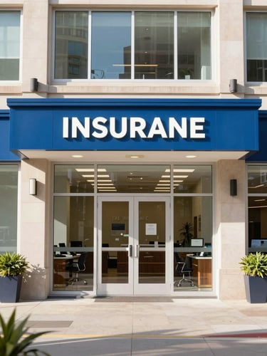 An authentic, bright environmental shot of a professional insurance office lobby in downtown Birmingham, with warm morning light streaming through windows.