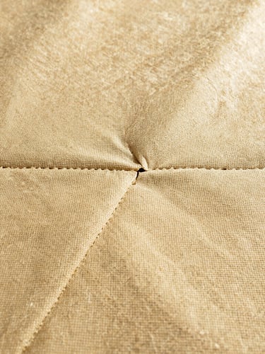 Macro photography of heavy-duty 1100 g/m² PVC-coated polyester fabric texture, showing the rugged weave and industrial heat-sealed seams.