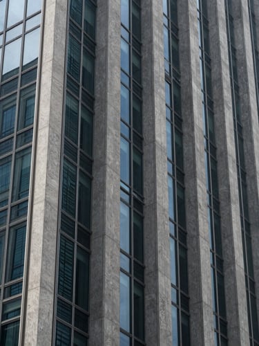 Sleek modern architectural detail of a financial district skyscraper, sharp concrete and glass angles, cool-toned daylight with deep slate shadows, 35mm photography