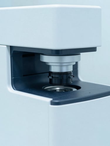 Macro shot of a high-throughput clinical chemistry analyzer, bright clinical lighting, sterile white and soft blue tones, sharp focus
