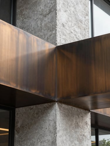 Abstract architectural close-up of brushed bronze and exposed concrete junctions, soft natural light, sharp geometric shadows