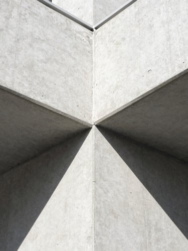 Extreme close-up of a flawless concrete join, sharp graphic shadows, architectural photography, high-contrast daylight, 35mm