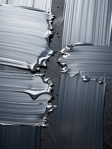 Extreme close-up of digital brush strokes on an obsidian canvas, cold silver light reflecting off liquid metallic textures, symmetrical composition