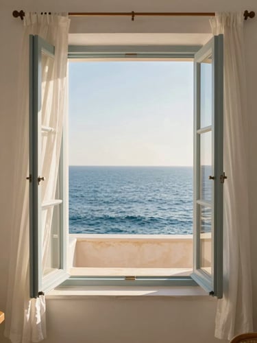 A bright, sun-drenched room with an open window looking directly onto the calm blue Mediterranean sea, white linen curtains blowing softly in the breeze, warm golden-hour light