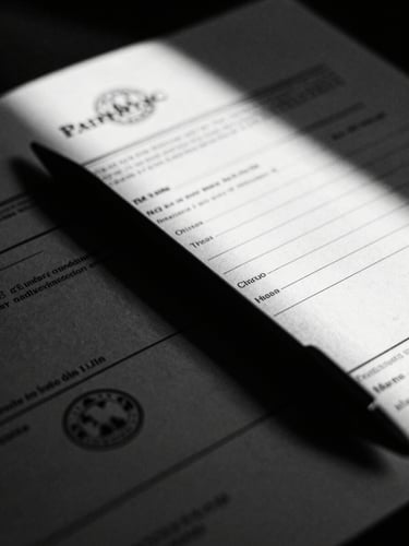 Extreme close-up of official trade documents with official stamps, high contrast low-key black and white photography, dramatic chiaroscuro lighting, sharp directional key light with deep shadows, 35mm film grain