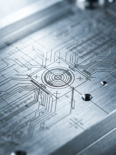 Macro shot of a brushed aluminum component with precise laser-etched technical guidelines under high-contrast cool studio lighting.
