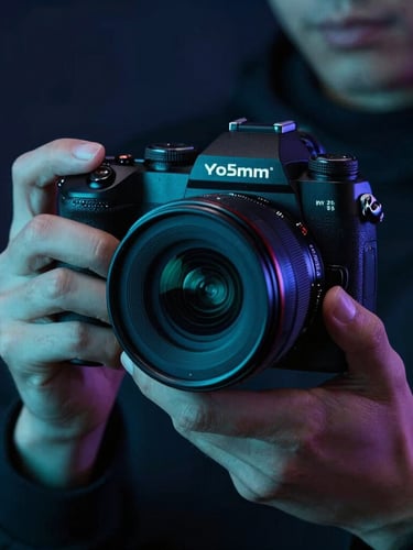 Sleek close-up of a digital creator holding a high-end camera, moody dark-mode ambient lighting with electric teal accents, sharp focus, 35mm
