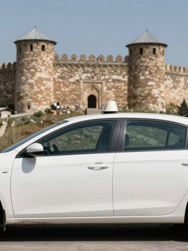 A clean white taxi waiting in front of the historic Harput Castle in Elazığ, bright natural daylight, authentic local atmosphere.