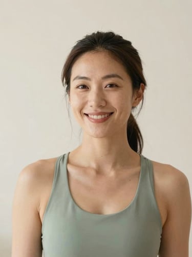 Candid, warm lifestyle portrait of a female wellness founder in natural morning light, smiling softly, clean sage and cream background