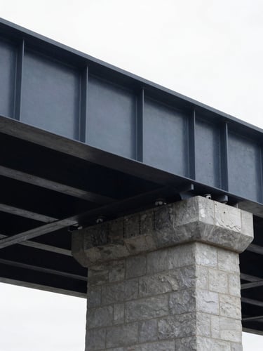 Architectural detail of a modern steel and stone bridge structure, clean lines, bright natural overcast daylight, deep slate tones