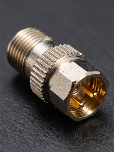 Sharp macro product photography of a heavy-duty M12 A-coded connector with gold-plated internal pins, high-contrast industrial studio lighting with sharp highlights reflecting off the metallic threaded coupling, dark slate background, 50mm lens