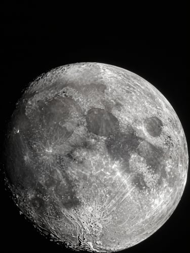 Stark high-contrast astronomical photograph of a lunar crater rim under harsh single-source vacuum light, deep black shadows, razor-sharp dust details, minimal composition.